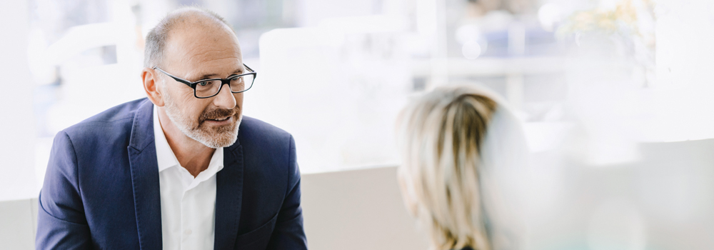 Salesman talking to woman